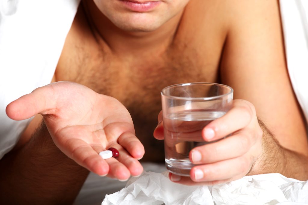 Male patient consulting doctor about stimulant medication side effects